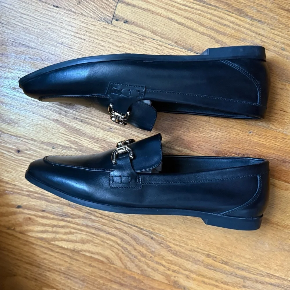 Zara Black Leather Slip on Loafers with Gold Horsebit Buckle Trim.